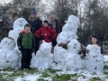 Booth-family-snowman-family-in-woods-_n