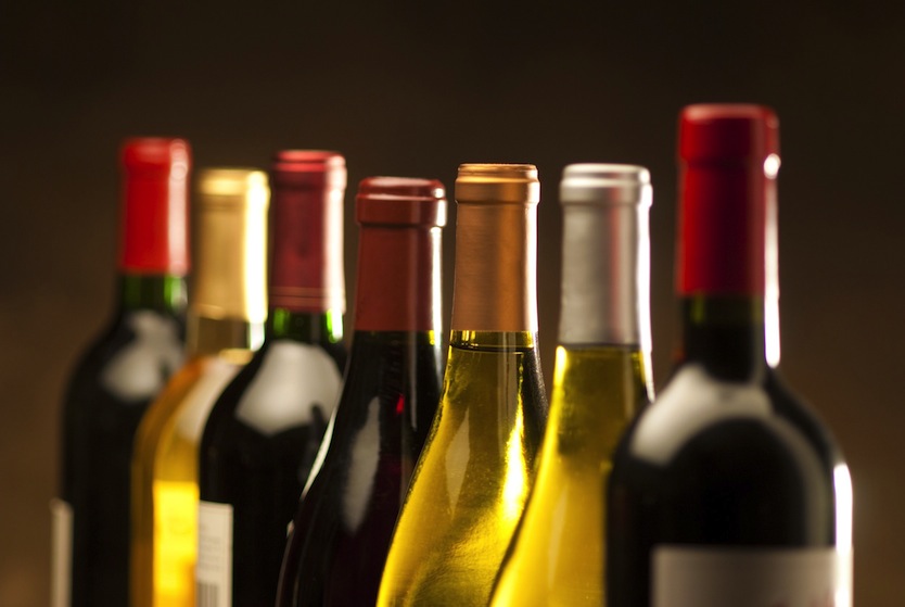 10756383 – wine bottles in a row with limited depth of field